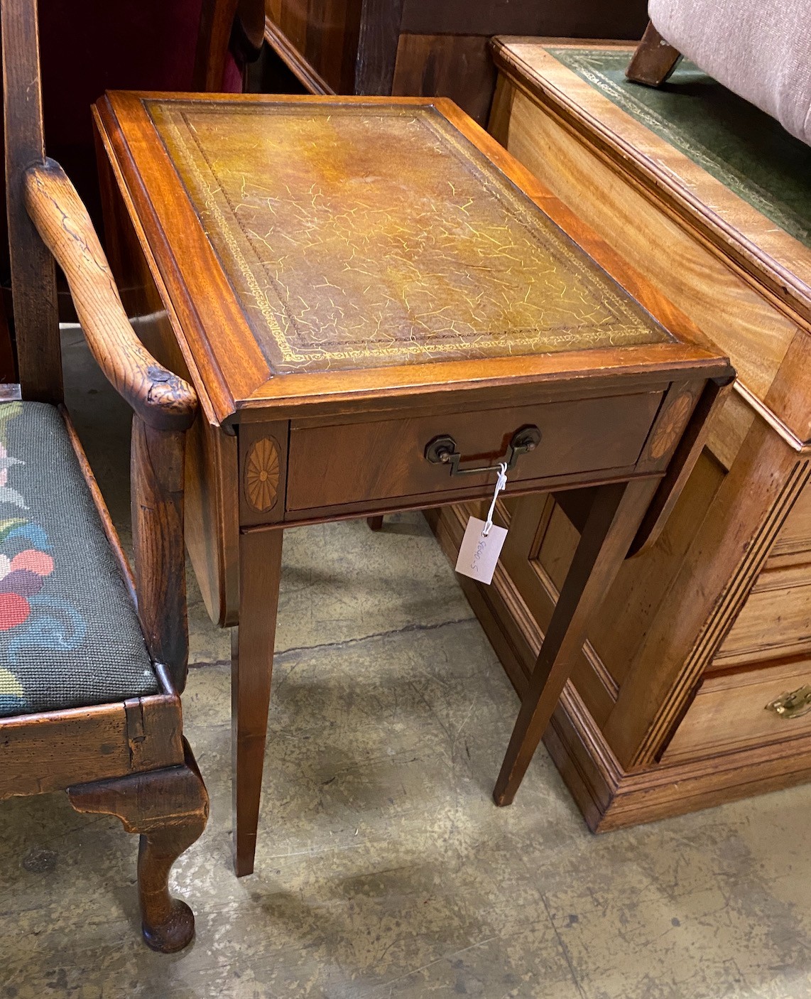 A reproduction mahogany Pembroke table with leather inset top, width 44cm, depth 61cm, height 68cm